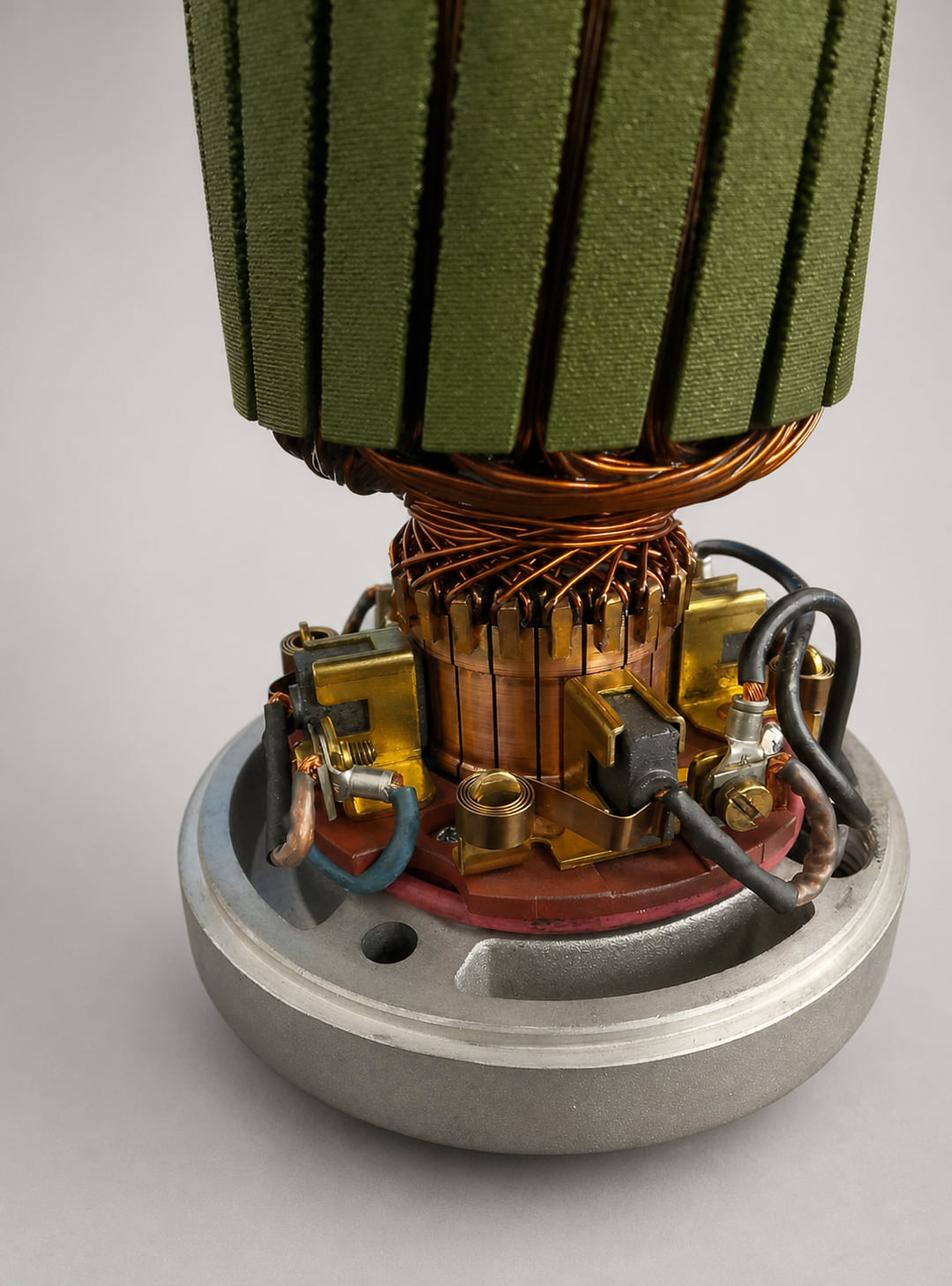 Detail of a rebuilt AutoStore robot drive motor showing the new brush gear assembled around the freshly machined commutator on the end bracket