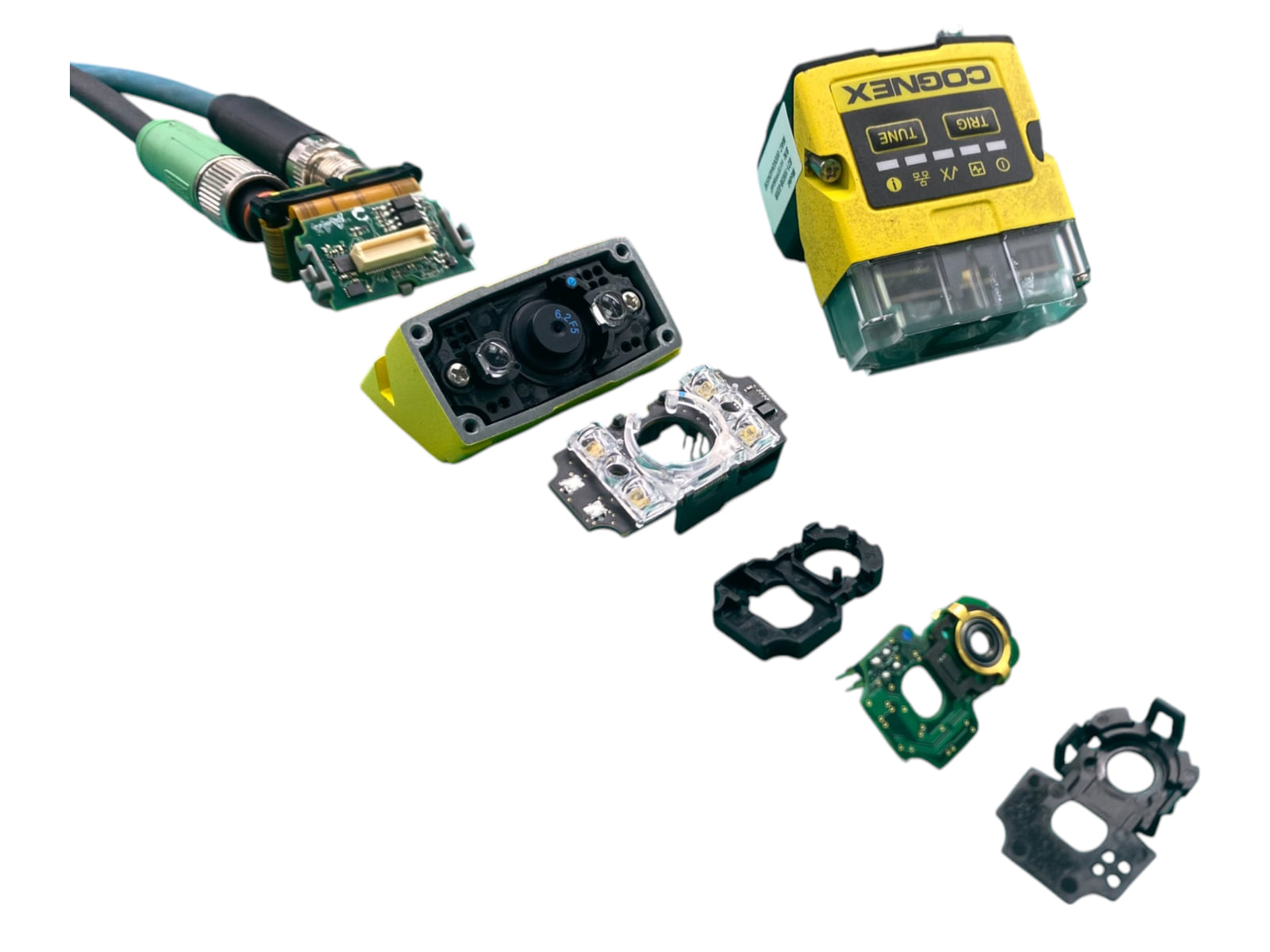 An industrial barcode scanner disassembled into its housing, lens, LED ring and sensor boards