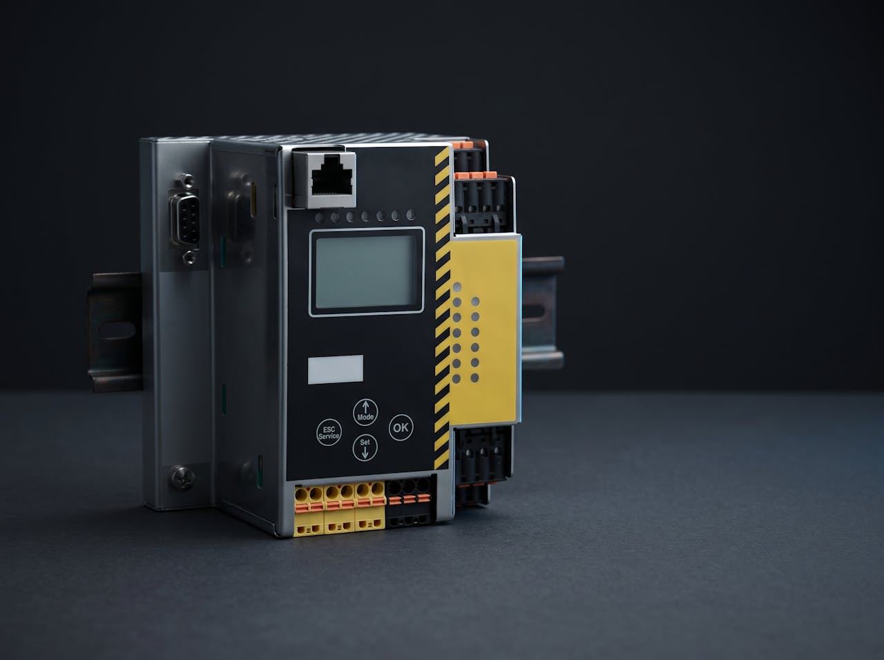 An AS-Interface gateway module on DIN rail with a yellow bus terminal